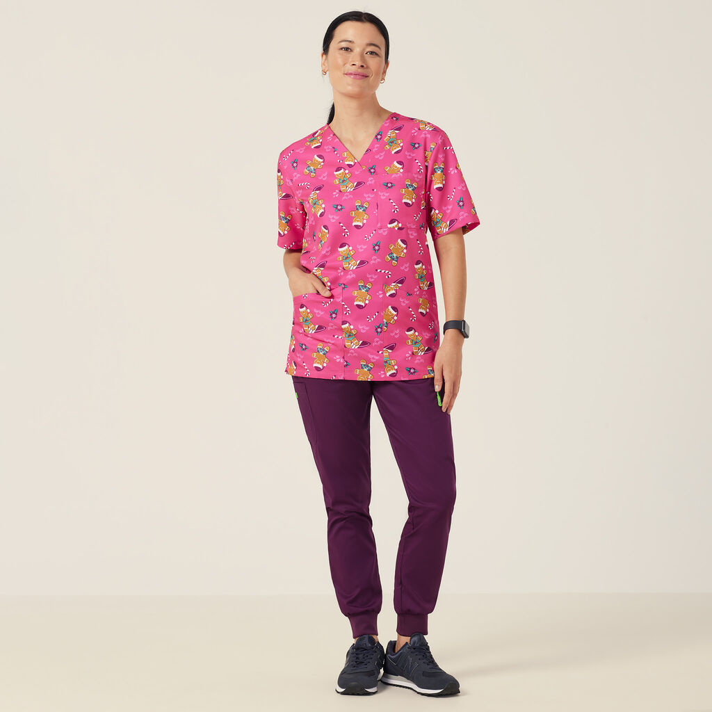Festive Gingerbread Surfer Print Scrub Top
